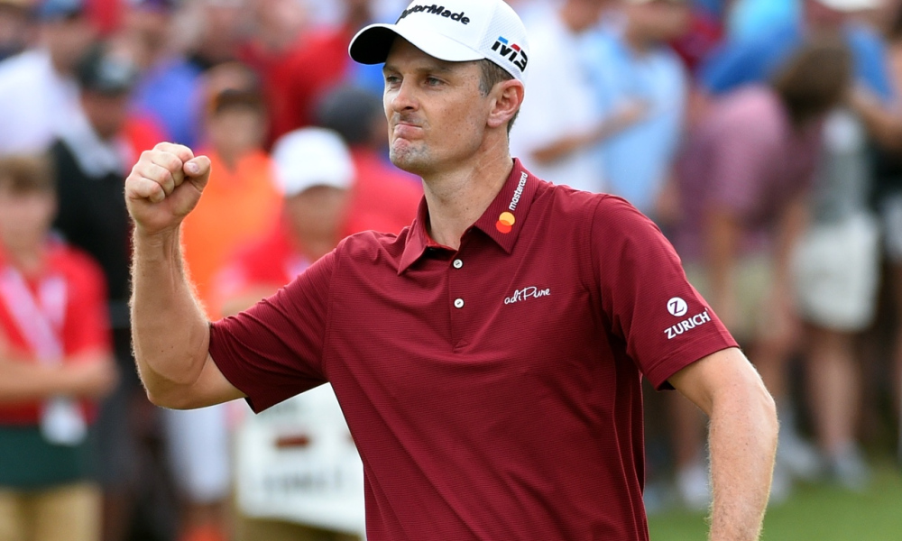 Justin Rose celebrating a made putt at the PGA Tour, wearing a red polo, white hat, and fist pumping in the air.