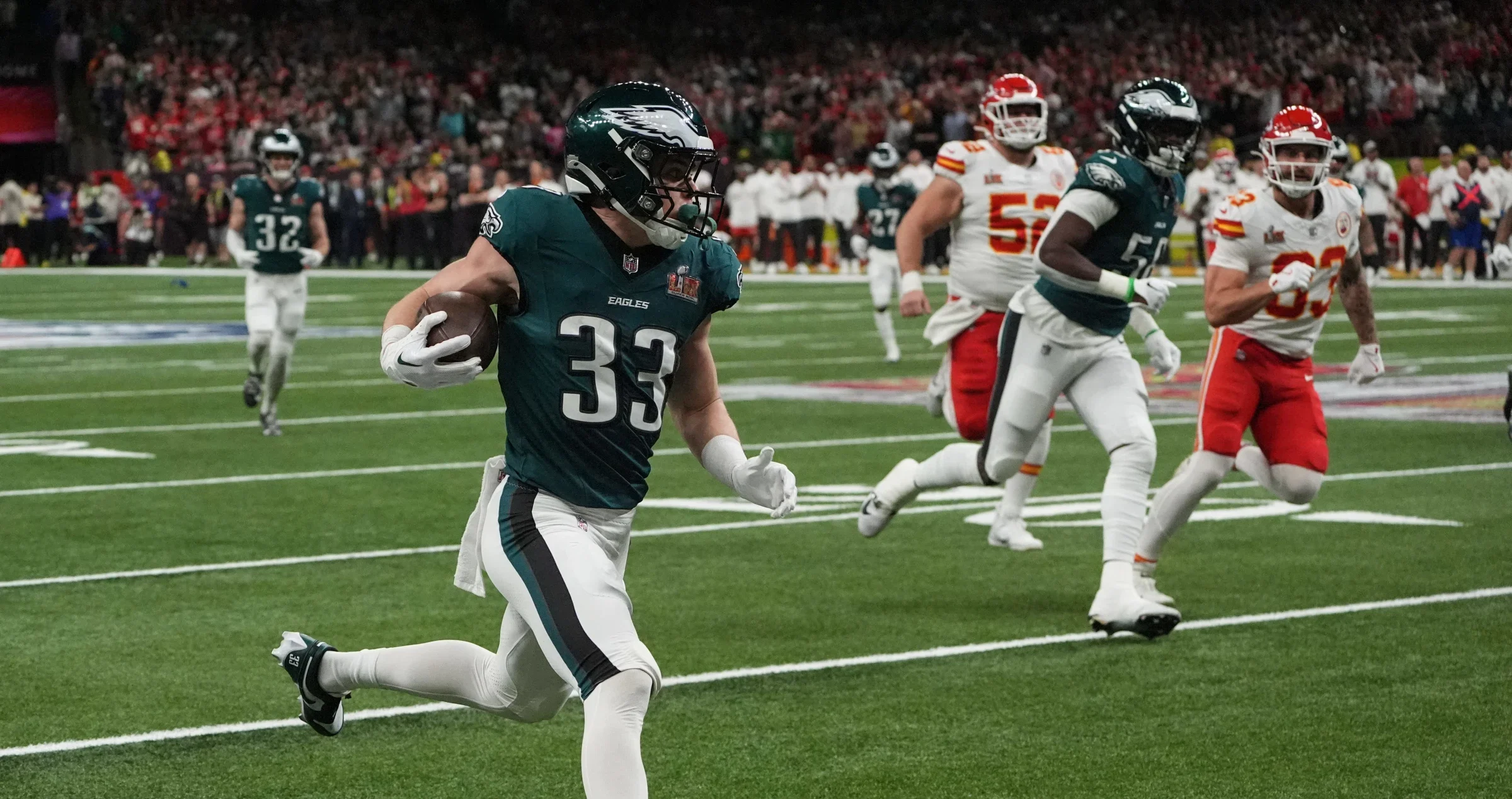 Cooper DeJean returns an interception for a touchdown down the sidelines before reaching the end zone.